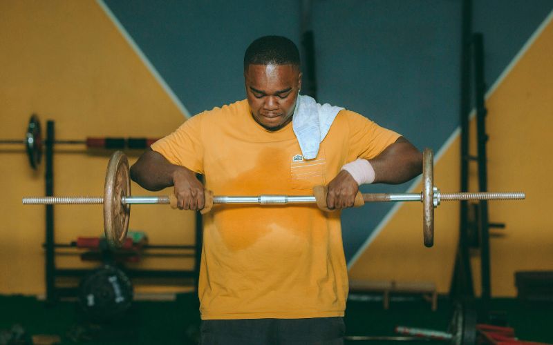 Person lifting weights.